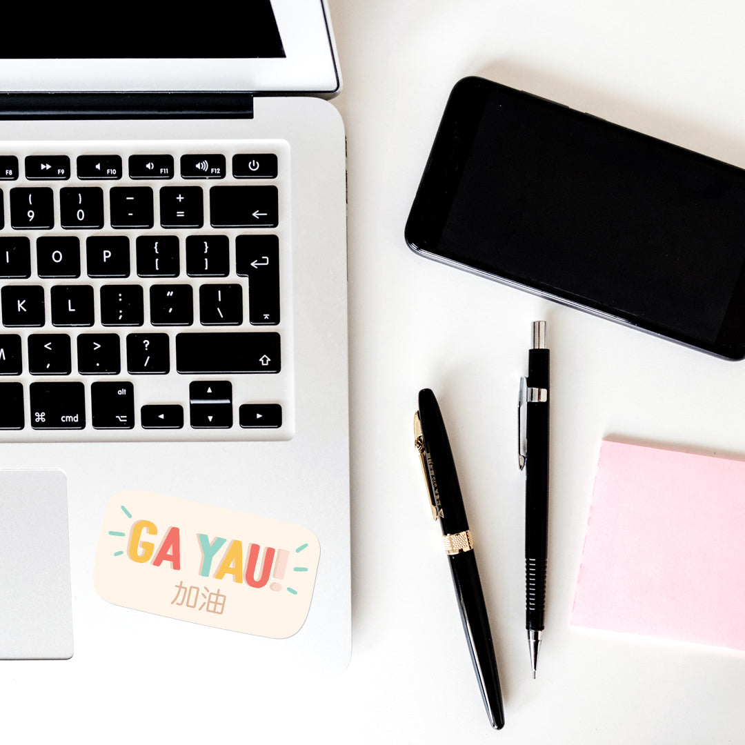 Ga Yau 加油 vinyl sticker on laptop