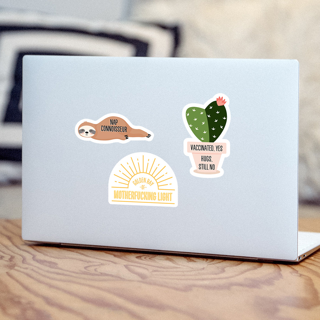 Golden ray of MF light vinyl sticker on laptop