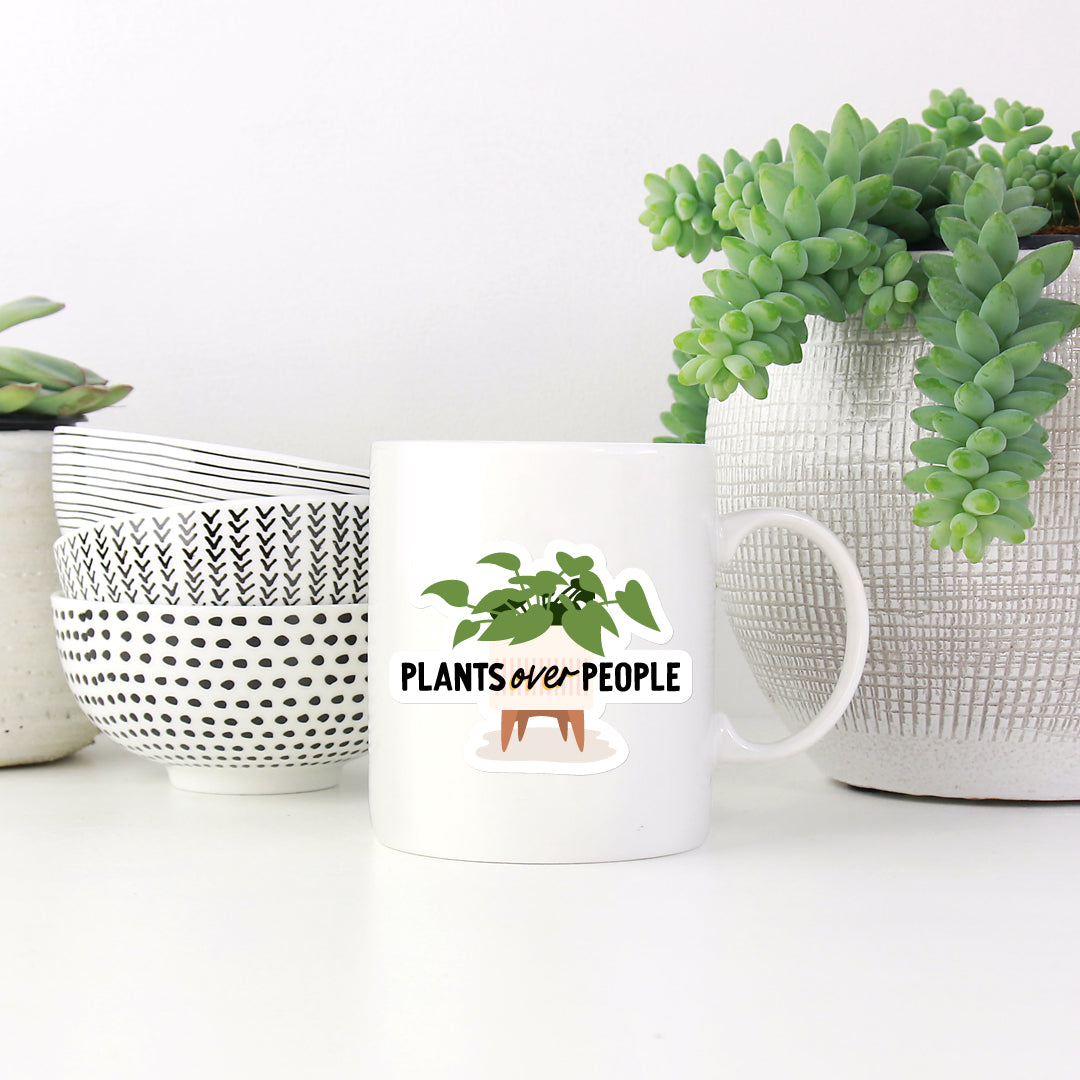 Plants over people vinyl sticker on white mug